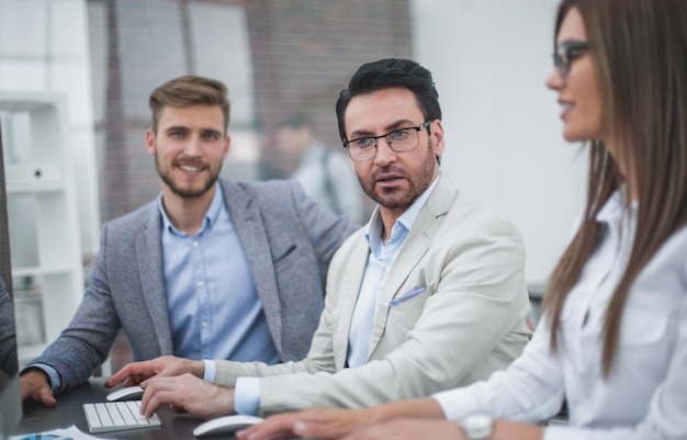 Close upbusinessman and employees sitting at the Deskbusiness people