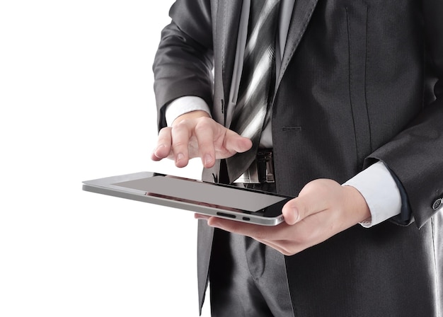 Close upbusinessman tapping the screen of the digital tablet