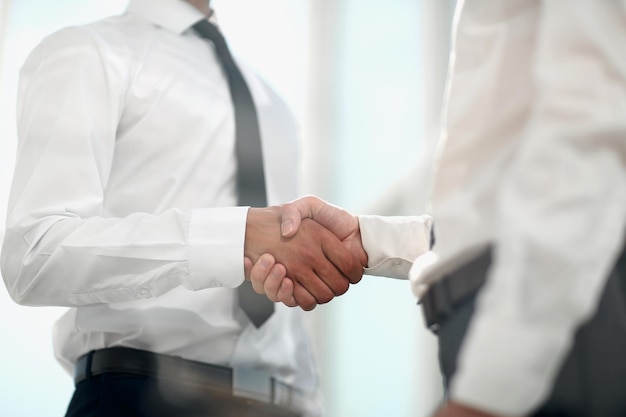 Close uphandshake business partners the concept of cooperation