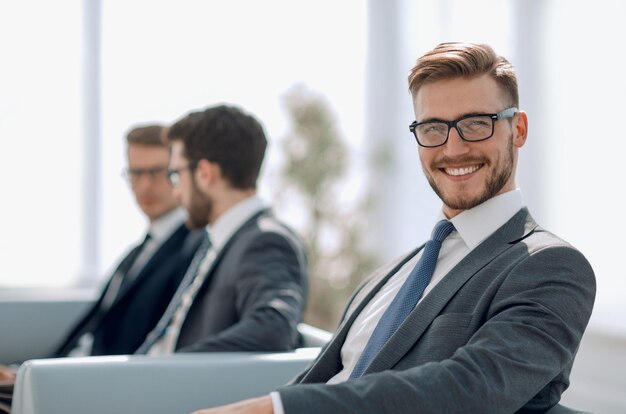 Close uphappy businessman sitting in modern officebusiness people