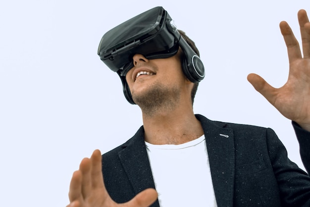 Close upyoung businessman in a virtual reality helmet