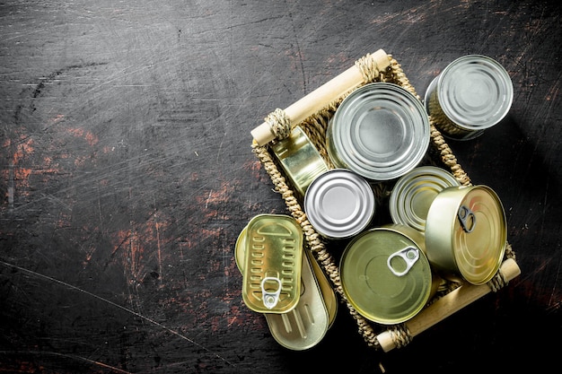 Closed cans of canned food on tray