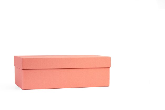 A closed pink shoes box on a white