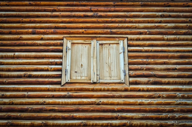 Photo closed window amidst wooden wall