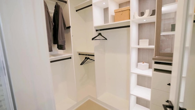 a closet with a white shelf that says  walk in closet