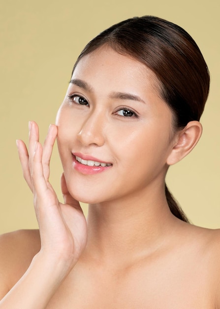 Closeup ardent young woman posing beauty gesture with clean fresh skin