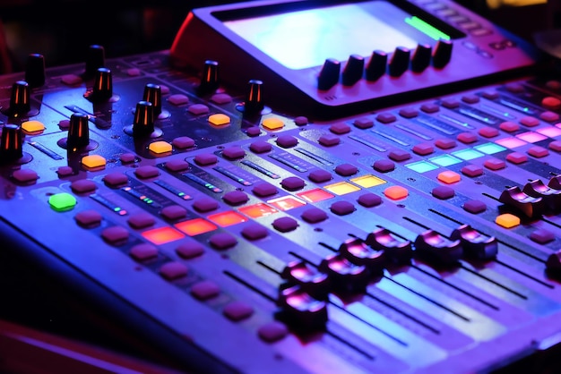 Closeup of an audio mixing control panel