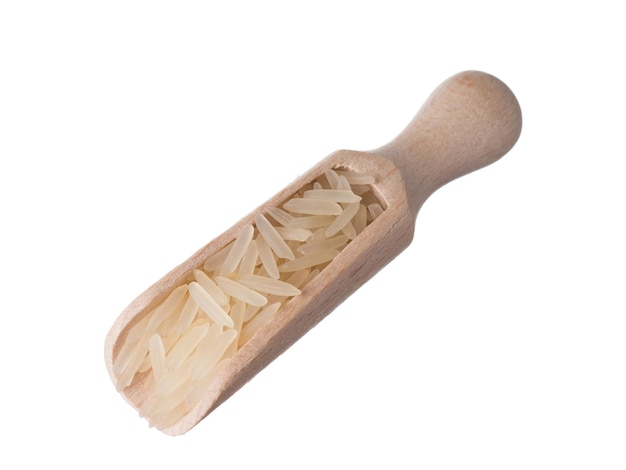 Closeup basmati rice in a wooden scoop isolated in white background