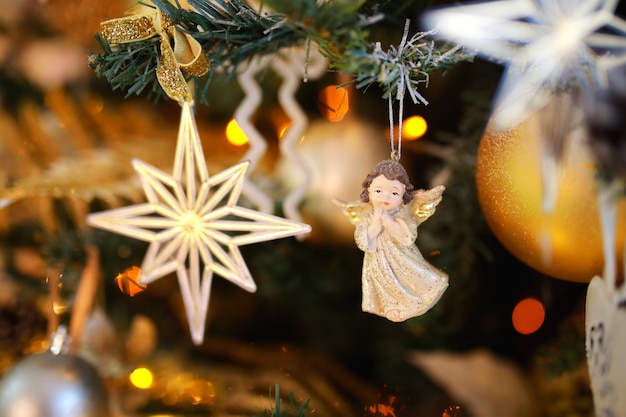 Closeup of Beautiful Christmas-tree decorations star and angel.