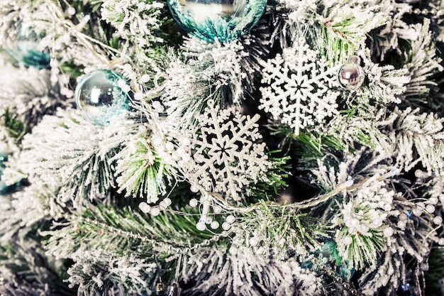 Closeup of beautiful color christmas decorations hanging on christmas tree.