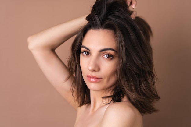 Closeup beauty portrait of a topless woman with perfect skin and natural makeup