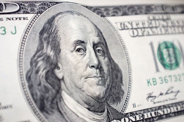 Closeup of Benjamin Franklin's face on the one hundred dollar bill