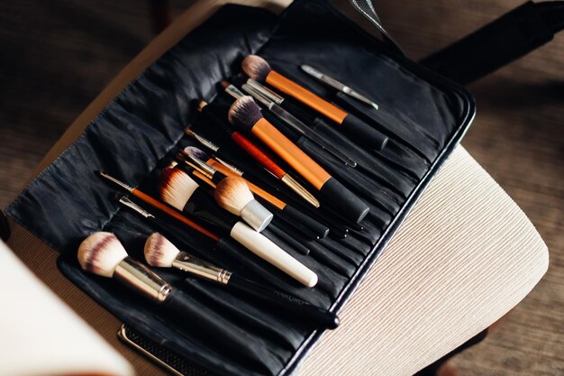 Closeup of a black case with a professional set of brushes for makeup