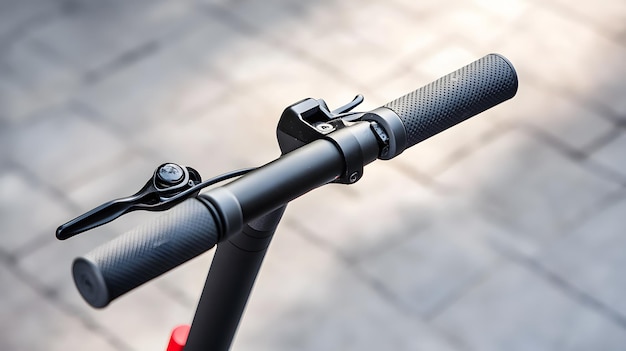 Photo closeup of a black electric scooter handlebar with textured grips and a brake lever