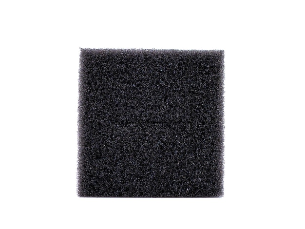 Closeup of a black porous sponge isolated on a white background Front view