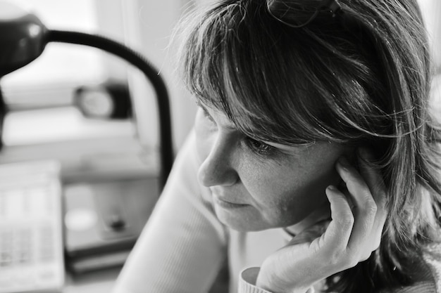 Closeup black and white portrait of a woman