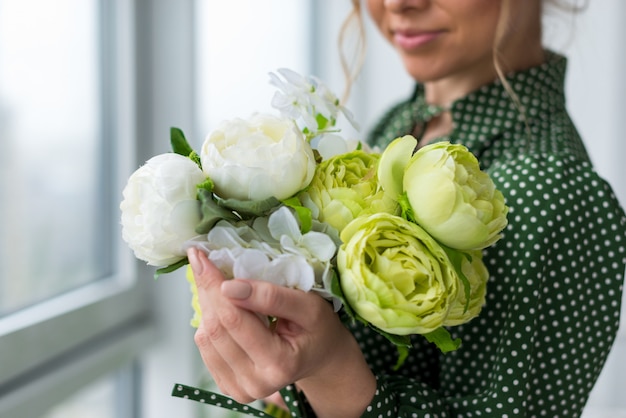 Closeup a bouquet of fresh peonies in the female hands - Image