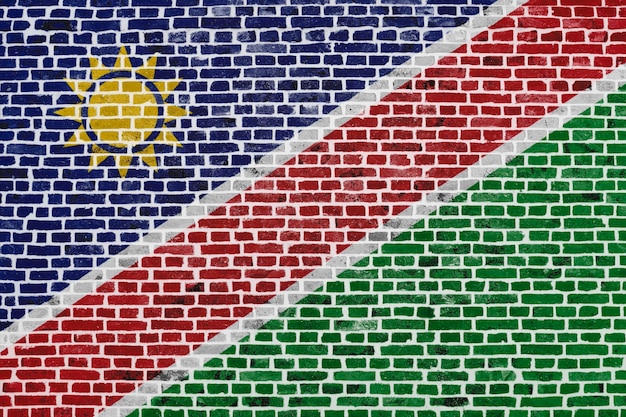 Closeup on a brick wall with the flag of Namibia painted on it