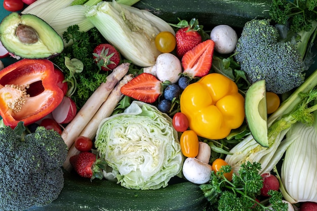 Closeup bright fresh vegetables fruits and berries