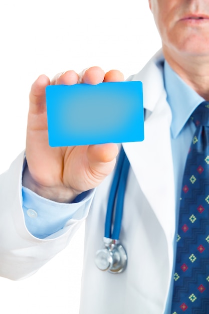 Closeup of business card in doctor's hand