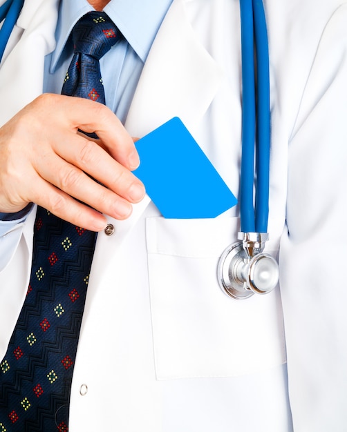 Closeup of business card in doctor's hand