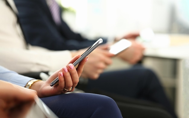 Closeup of business people hands are holding smartphone