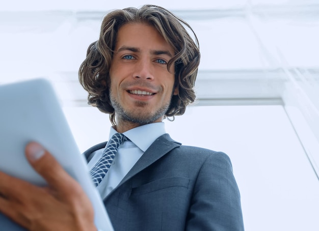 Closeup businessman working on the tablet