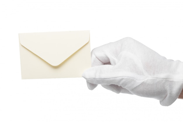 Closeup of a butler holding an envelope. man is unrecognizable