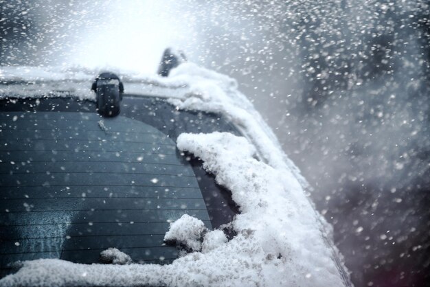 Closeup of a car in the snow in a winter city