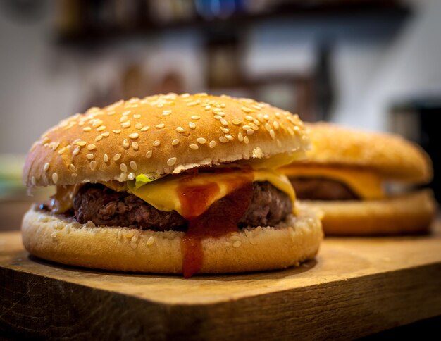 Closeup of cheeseburgers on wooden chopping board