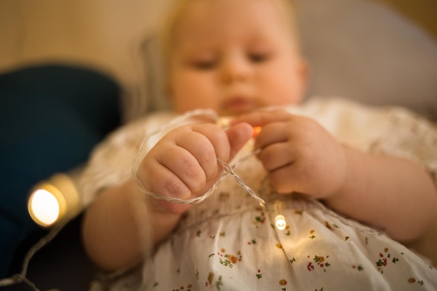 Closeup of a child's hands holding a garland