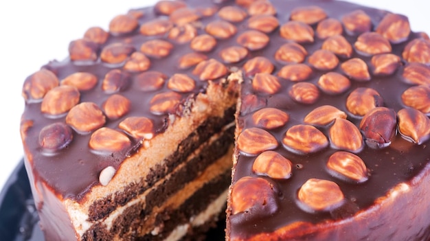 Closeup chocolate cake decorated with hazelnuts