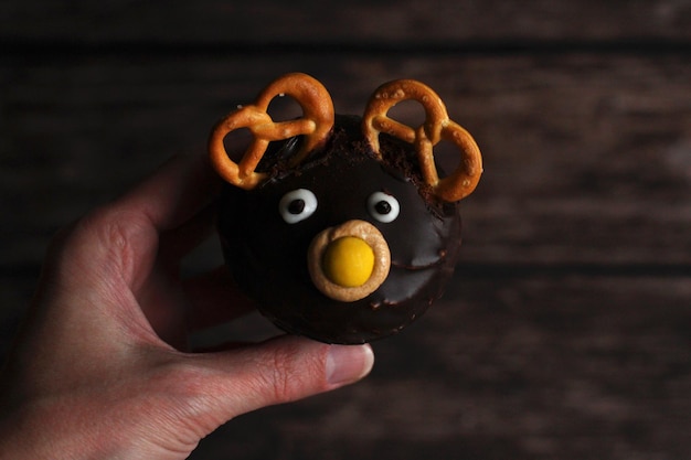 Closeup of a chocolate cake in the form of a deer on a dark background