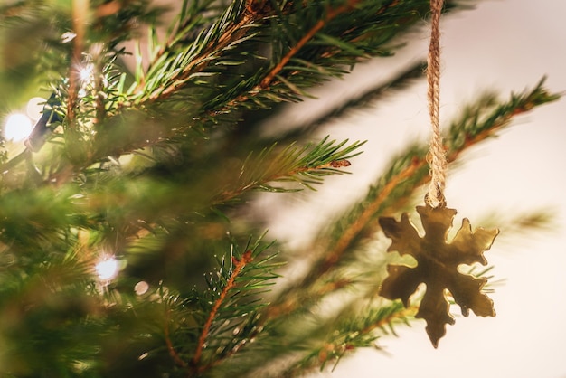 Closeup of christmas tree with decorations and fairy lights