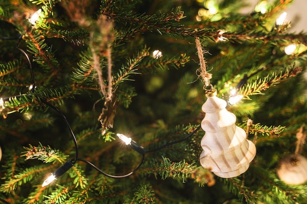 Closeup of christmas tree with decorations and fairy lights