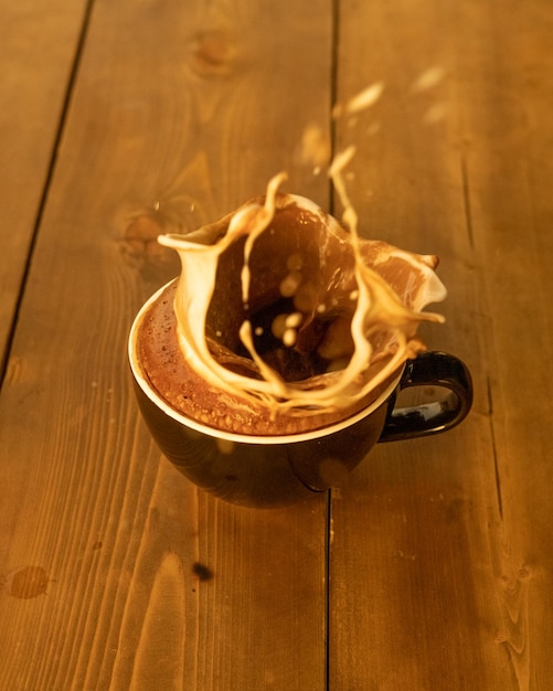 Closeup of coffee splashing out of the cup