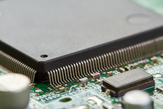 Closeup of computer chip on a part of electronic printed circuit board