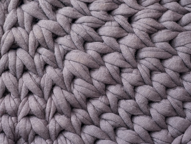 Closeup cotton grey knit blanket, warm and comfortable