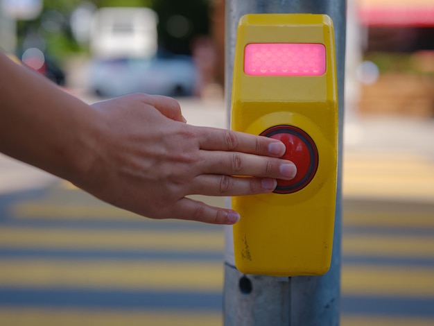 Closeup of a crosswalk signal button taken at a pedestrian controlled crossing