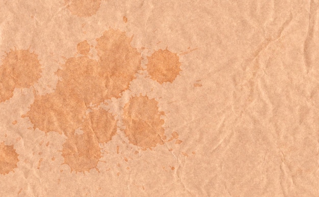 Closeup crumpled grunge brown paper texture background Brown paper sheet with splash brown