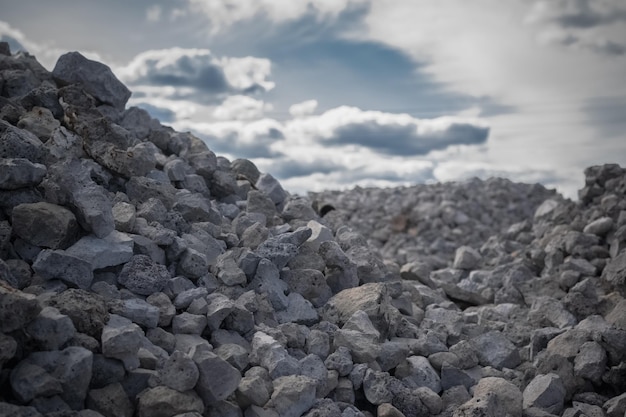 A closeup of the crushed stone of large fractions against the blue sky