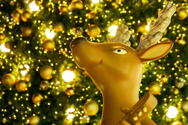 Closeup deer head Christmas doll with Christmas balls on bokeh of Christmas lighting background