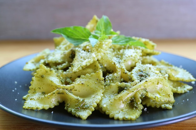 Closeup of Delectable Bowtie Pasta or Farfalle in Pesto Sauce