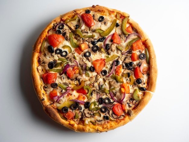 Closeup of a delicious vegetarian pizza with vegetables and mushrooms on a white background Top view flat lay Junk food