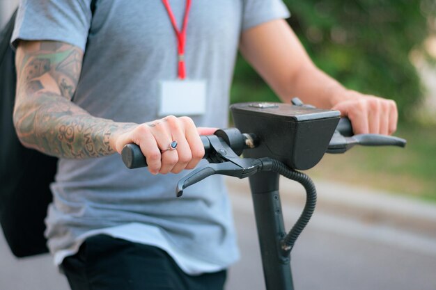 Closeup of a delivery man riding an electric scooter