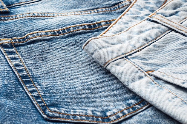 Closeup of the denim pockets seams Elements of denim clothing Jeans background for sewing Natural durable denim fabrics