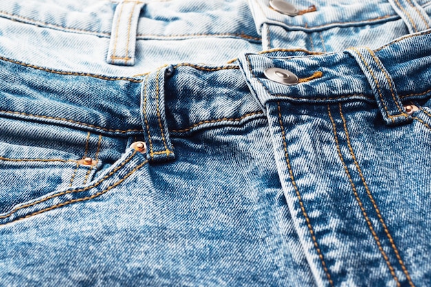 Closeup of the denim pockets seams Elements of denim clothing Jeans background for sewing Natural durable denim fabrics