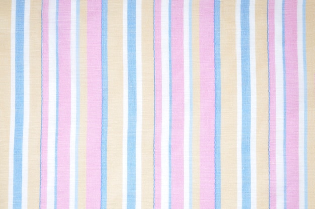 Closeup detail of blue, pink, light brown and white striped fabric