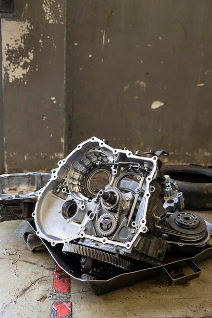 Closeup detail of car engine in service center with softfocus and over light in the background