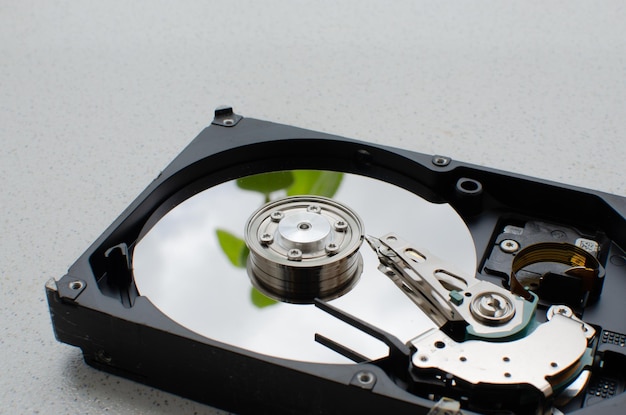 Closeup detail of a disassembled HDD showing its internal structure and technology for reading and writing data